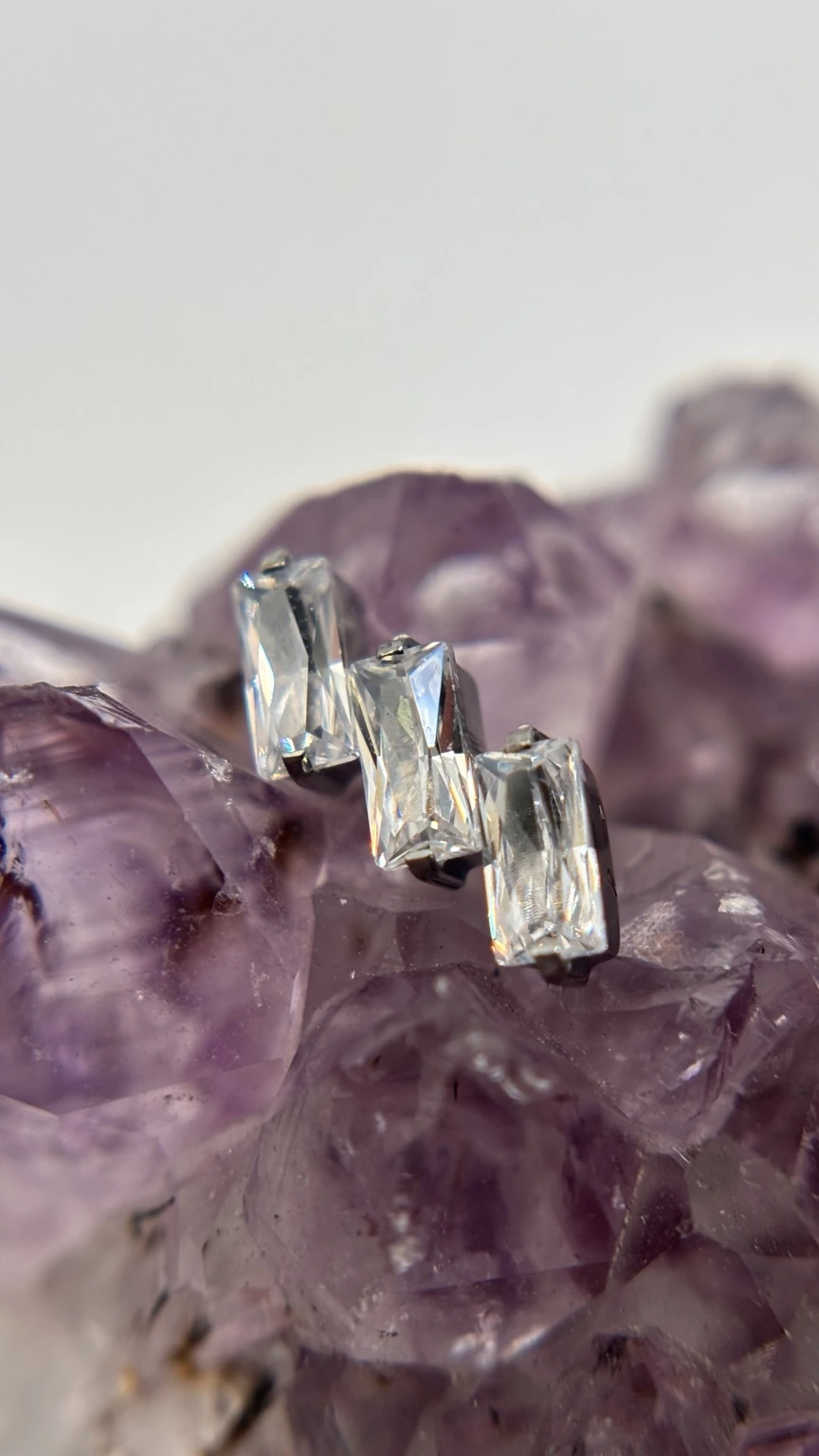 Crystal jewelry photographed on amethyst