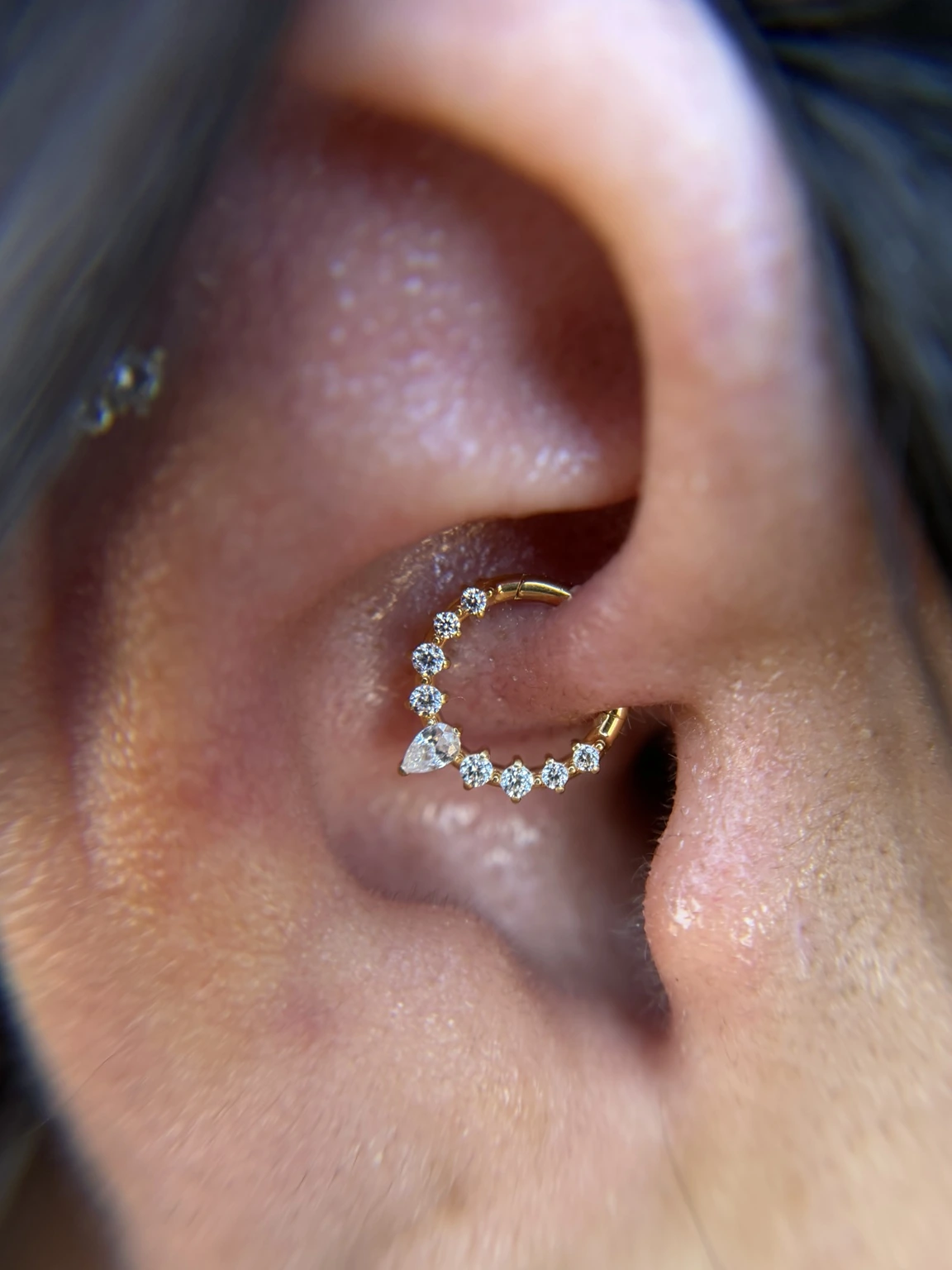 Finished gold and crystal piercing