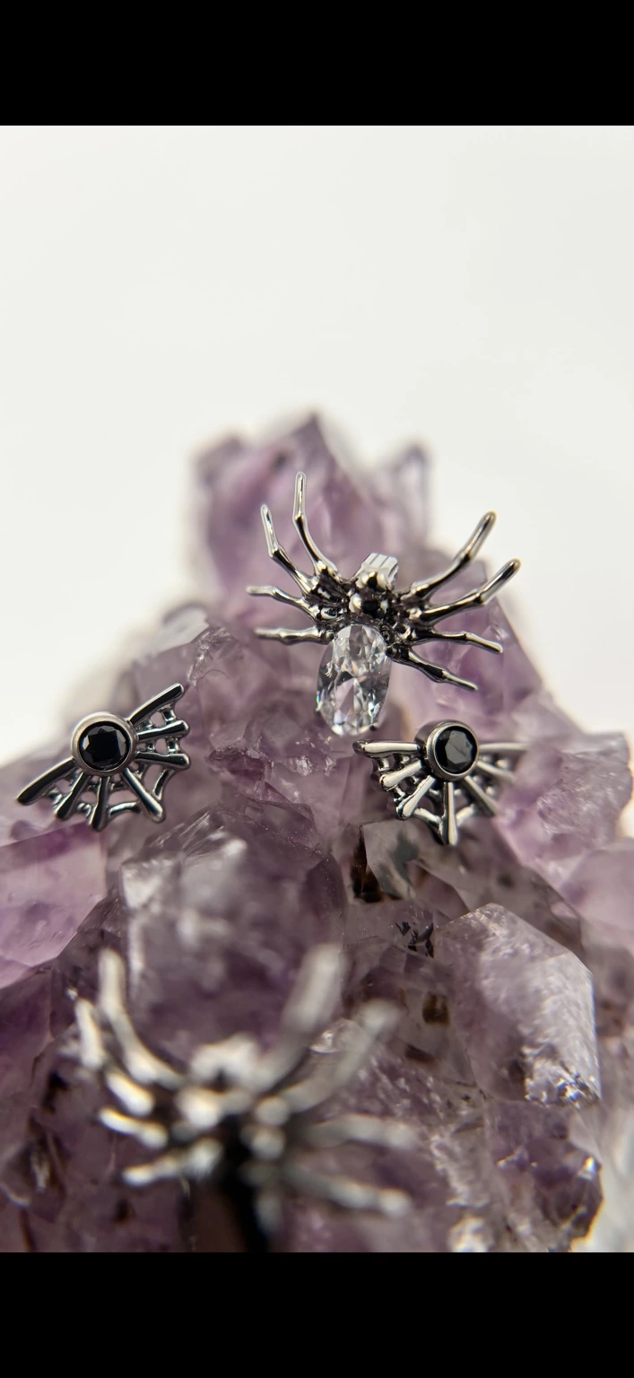 Sculptural jewelry displayed on amethyst