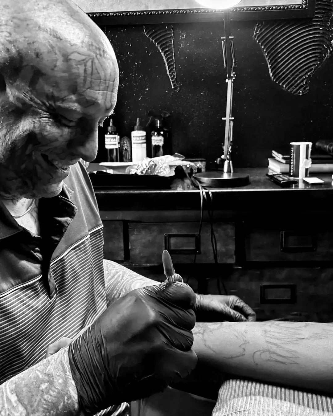 Artist preparing a tattoo stencil
